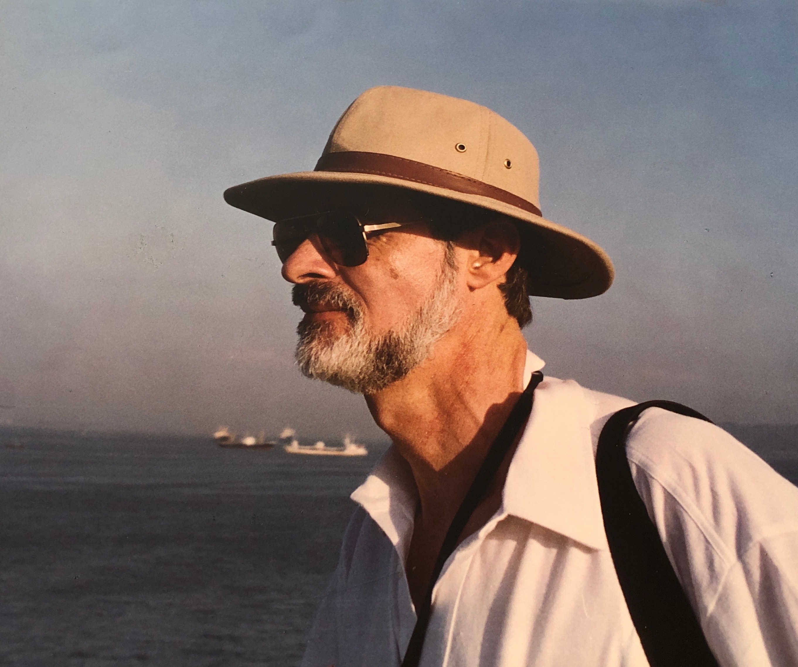 Ridley Nelson in a broad-brimmed hat beside the sea
